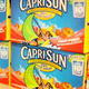 Boxes of Capri Sun on grocery store shelf